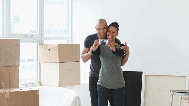 A couple celebrating their new apartment.