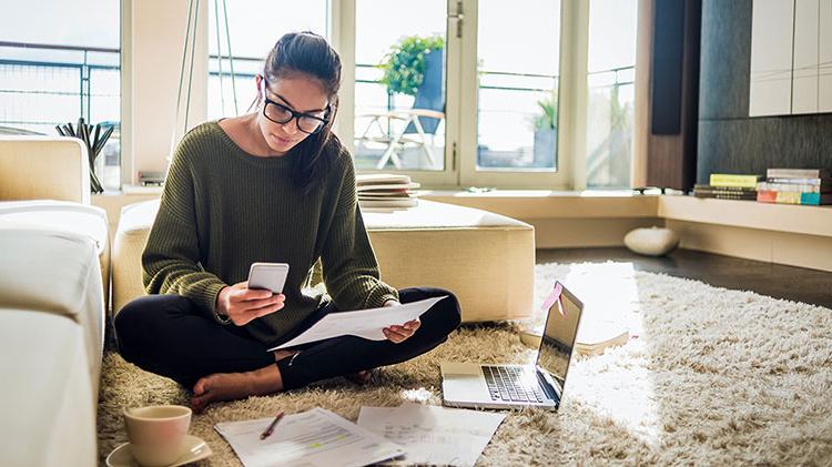 A woman is making financial decisions about college.